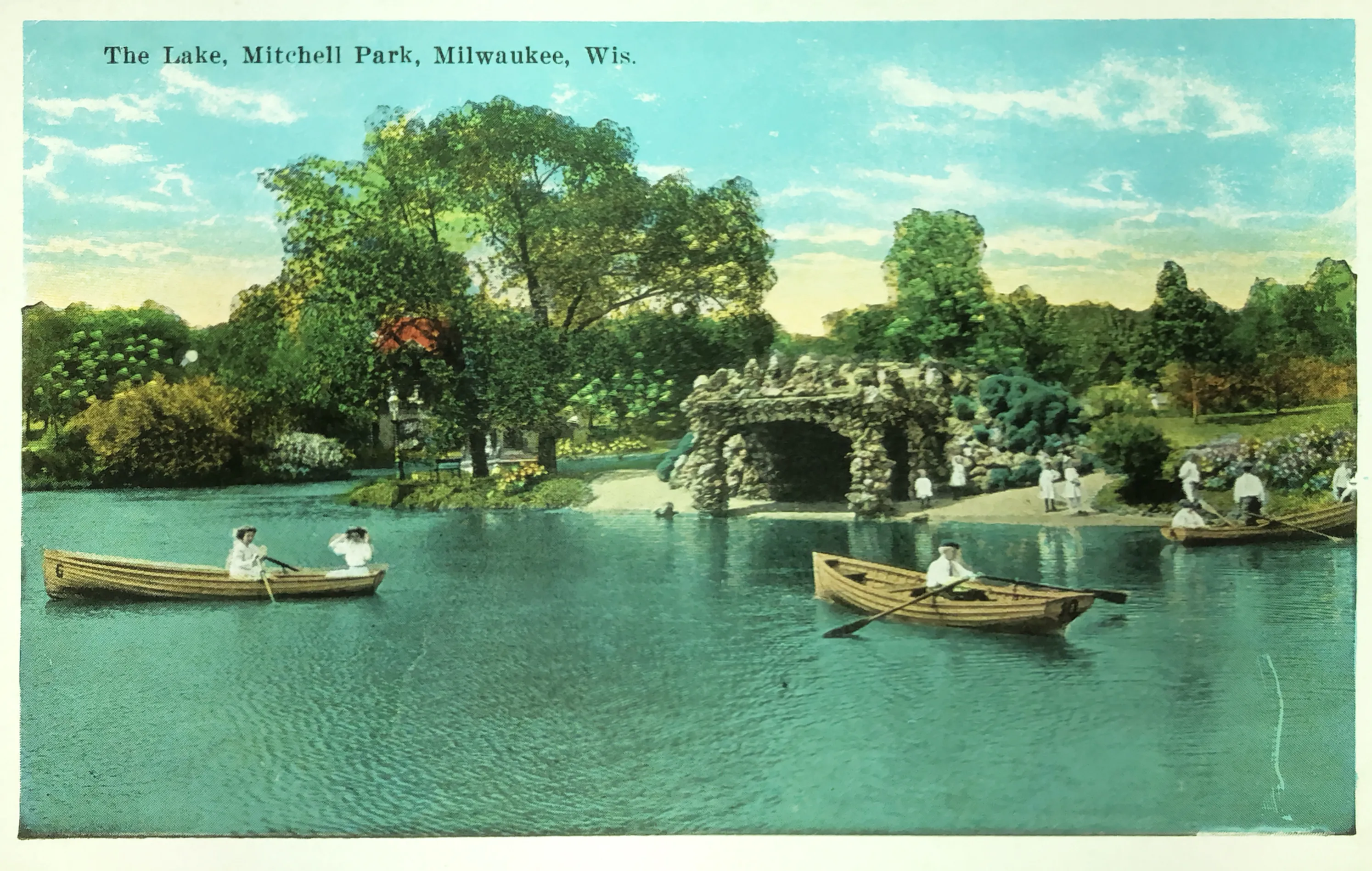 color postcard from the early 20th century shows row boats on a lagoon